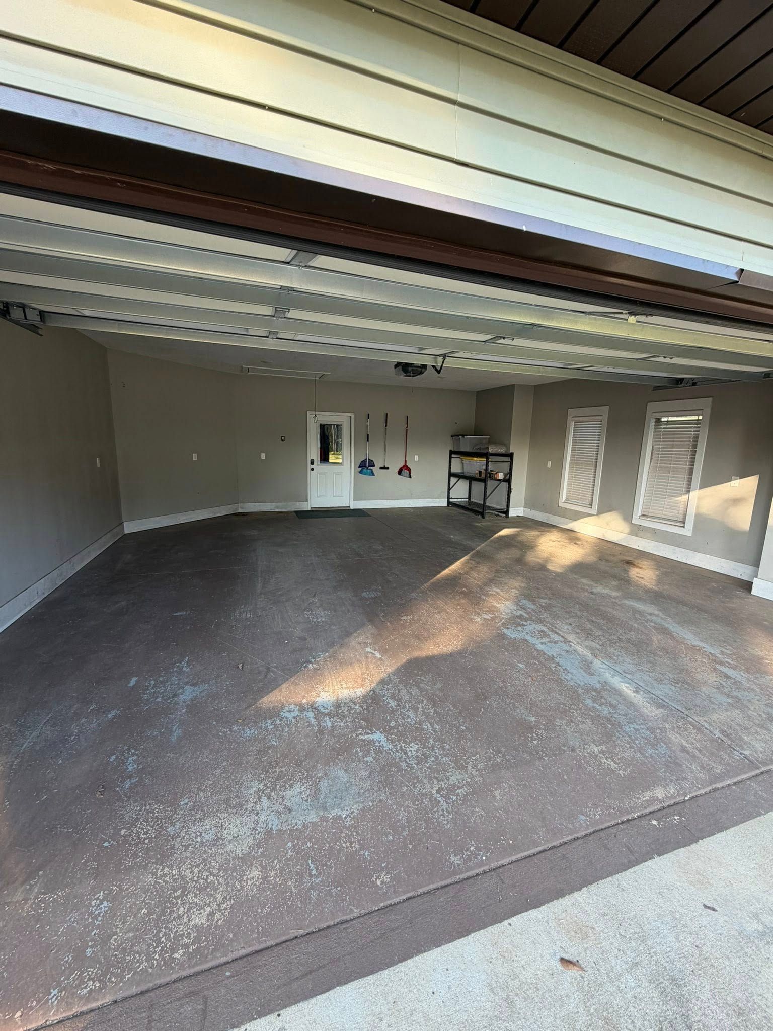 Untreated concrete garage floor before the coating goes down