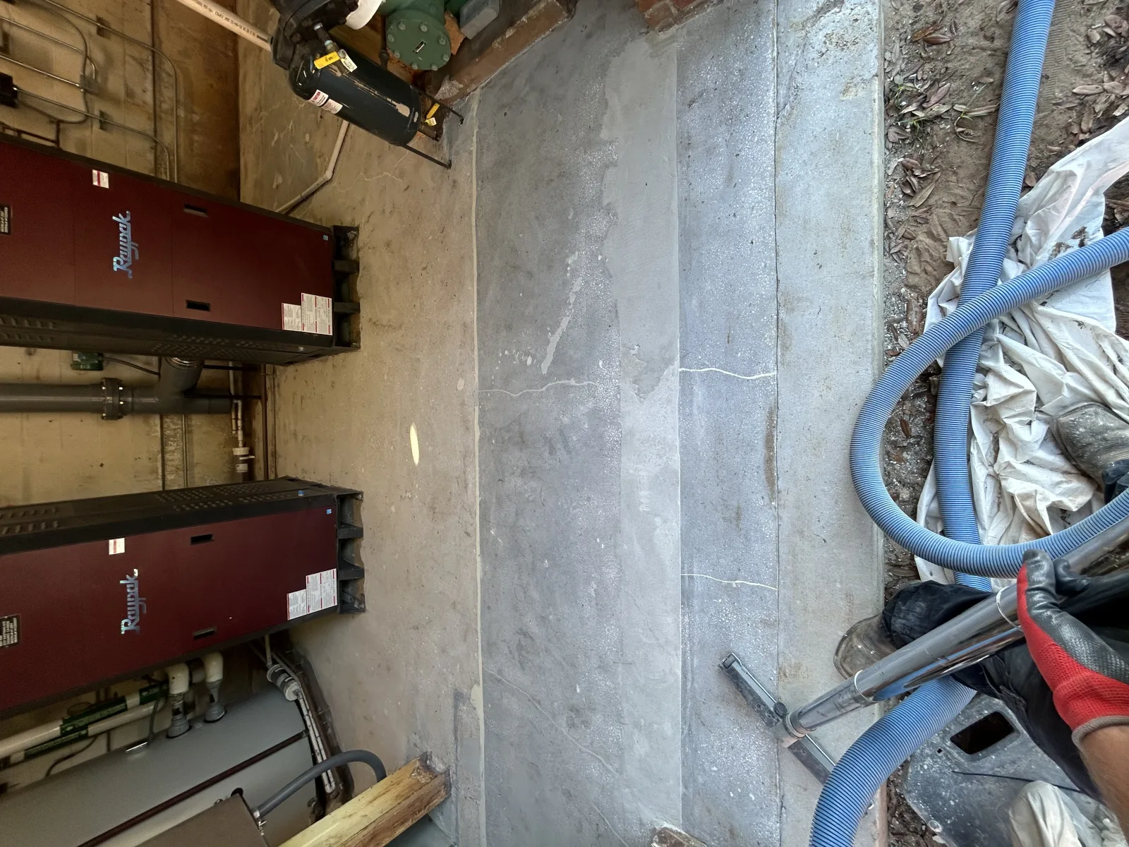 Fresh grey floor coating running between plant and electrical panels